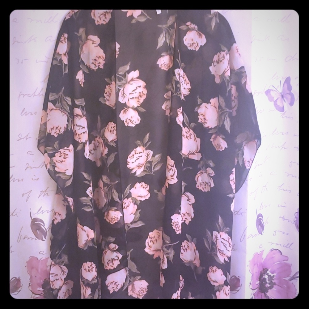 Black sheer blouse with pink roses.